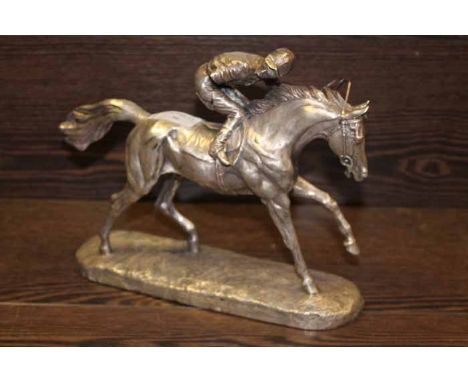 WHITE METAL SCULPTURE OF A HORSE AND JOCKEY
Note: item is repaired