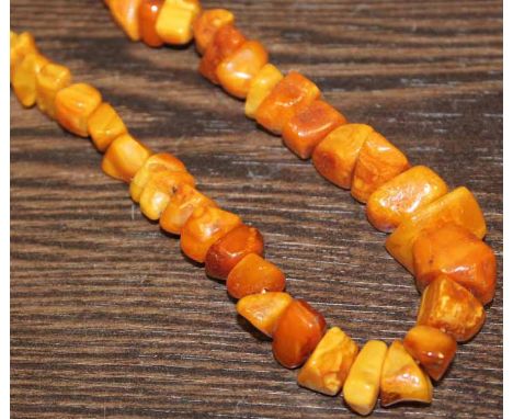 VINTAGE RAW AMBER BEAD NECKLACE
with rough unfashioned beads of varying shapes and sizes, 46cm long