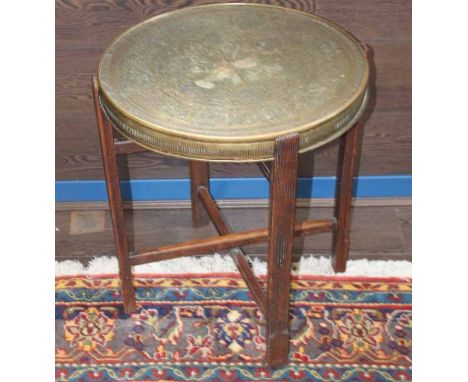 INDIAN BRASS TOPPED TABLE
on a wooden stand, 51cm diameter, 62cm high