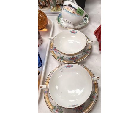 A Royal Worcester V.J.P fishing large breakfast cup and saucer, and a pair of Royal Worcester soup bowl and saucers 