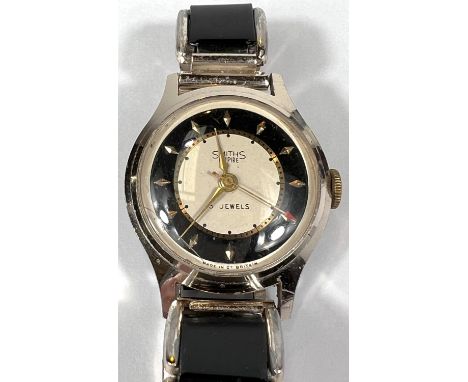 SMITHS EMPIRE: a vintage c.1950's manual watch with black and cream dial, gold hands, seconds hand and batons, black and silv