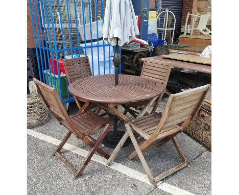 A teak folding garden set with circular table and four chairs with umbrella 