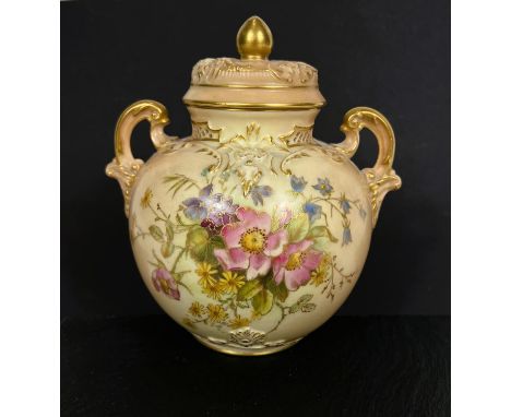 A Royal Worcester lidded double handled vase, model No. 1515, decorated with flowers with gilt highlights, ht 16cm.  In good 