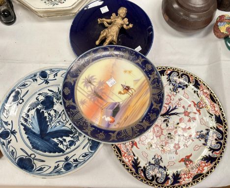 A Royal Crown Derby plate; a Noritake style plate; a Delft dish 