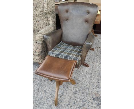 A brown leather effect button wing back armchair on rotating pedestal base with stool 