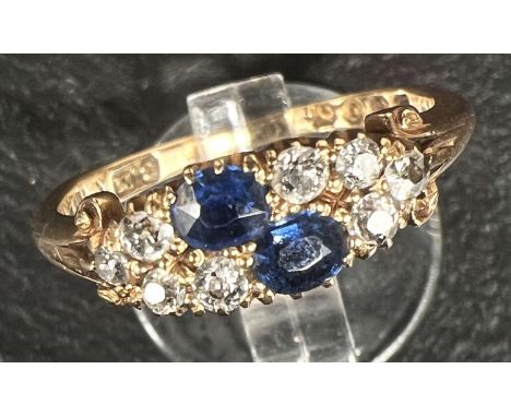 A ladies dress ring set 2 sapphires and 8 diamonds, 18 carat gold shank 