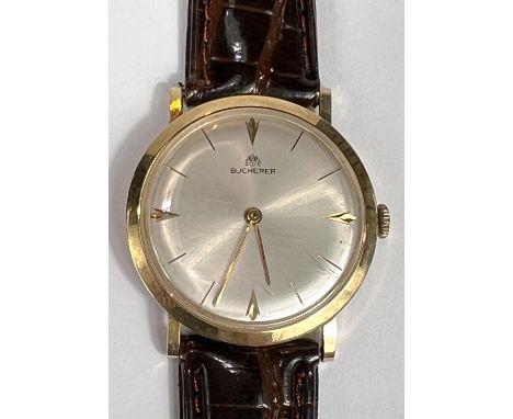 BUCHERER: a c. 1970 Swiss manual watch with silver dial, gold hands and batons, case stamped 18K 750, ref 16724420, with new 