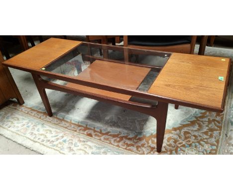 A mid 20th century teak G-Plan 'Fresco' coffee table with teak and glass sectional top with shelf below, 44 x 137 x 52cm 