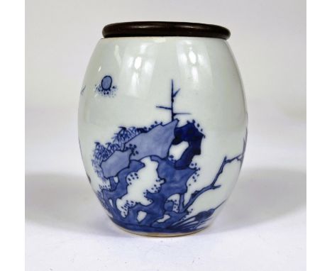 A Chinese blue and white barrel shaped vase with leaf mark to base and wooden lid, ht. 8cm and a Chinese blue and white minia