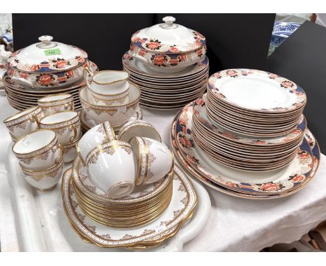 A Burslem Leighton pottery dinner service Imari type pattern, two large meat plates, two tureens, 47 plates, bowls etc; A Law