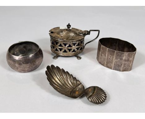 A 19th century continental caddy spoon with shell bowl; 4&nbsp;hallmarked silver items:&nbsp; 2 napkin rings; mustard pot; an