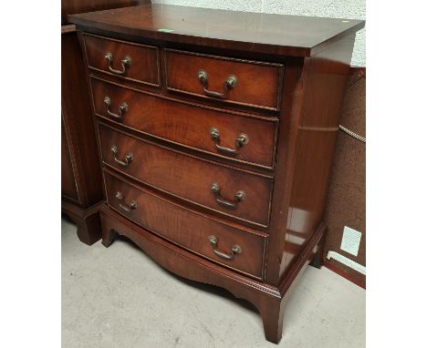 A reproduction figured mahogany chest of 3 long and 2 short drawers on bracket feet&nbsp;by&nbsp;"Reprodux"&nbsp; 
