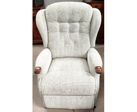 An electric easy chair in cream fabric button back 