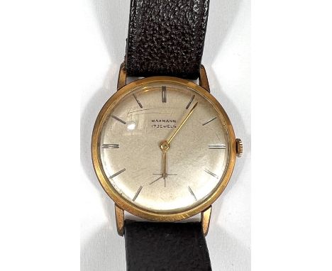 WAKMANN: a c.1950's ultra thin manual watch with beige dial, gold hands and silver batons, sub second dial on Microma Kangaro