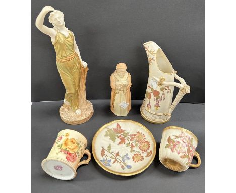 A Royal Worcester figure with outstretched arms, in subdued green porcelain; 5 items of Royal Worcester:&nbsp; a 'monk' candl