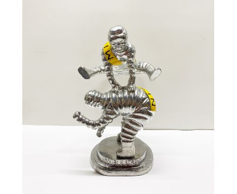 An unusual silvered metal advertising item, H. 36cm.