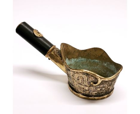 A Chinese brass and wooden handled ladle, L. 26cm.