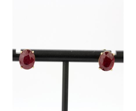 A pair of 9ct yellow gold ruby set stud earrings, L. 0.9cm, one butterfly replaced.