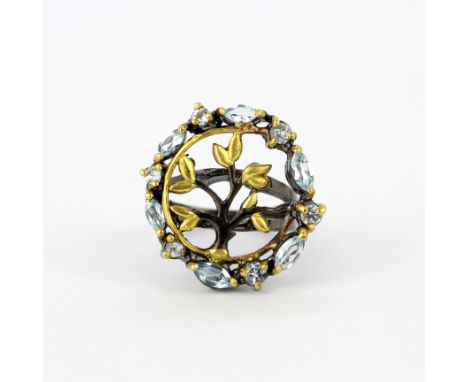A 925 silver gilt ring set with blue topaz, ring size R.