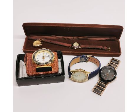 Four vintage watches including Anna Bella and a travelling clock.
