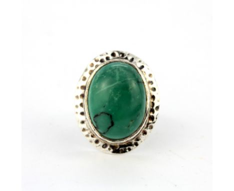 A 925 silver ring set with a large turquoise, ring size R.5.