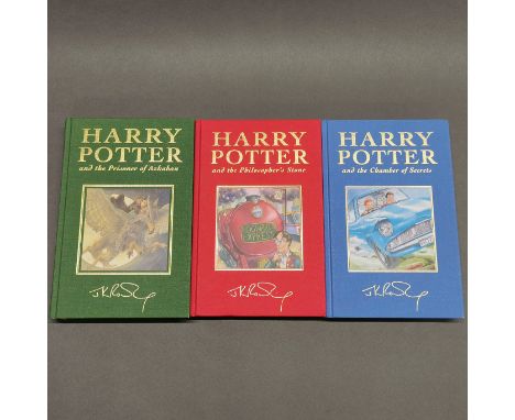 A first edition unsealed hardback Harry Potter and the Chamber of Secrets novel, together with two further hardbacks of priso