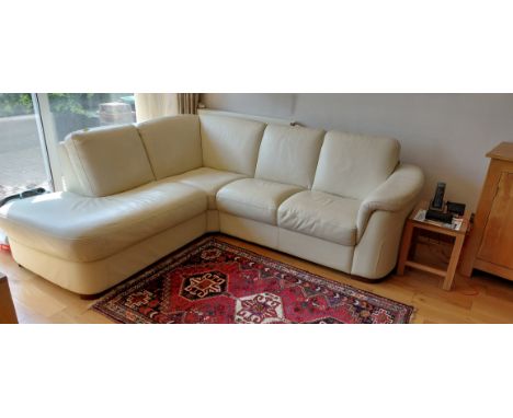 A large Italian cream leather three sectioned sofa.