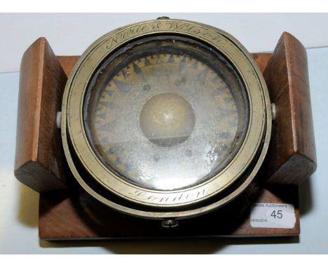 Wood mounted brass ships compass on gimbal, the brass engraved 'Noue and Wilson London'