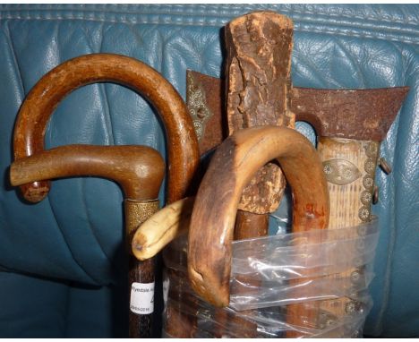 Late 19th C ebonised walking cane with unusual horn handle with gilt metal collar, a selection of other walking sticks, triba