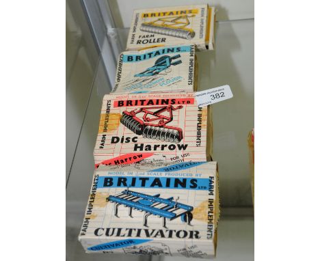 Four Britains die cast farming implements 'Culivator', 'Disc Harrow', 'Three Furrow Plough' & 'Farm Roller' all in original b