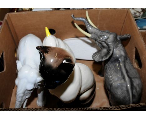 Large Bewsick elephant (tusks and trunk damaged), parakeet, large Siamese cat and one other glazed elephant 