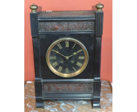 A 19th Century French Belge noir and parcel gilt mantel clock