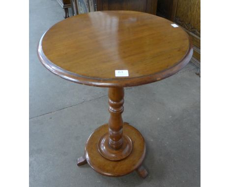 A Victorian mahogany circular lamp table