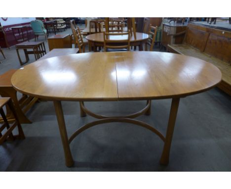 An Ercol extending dining table