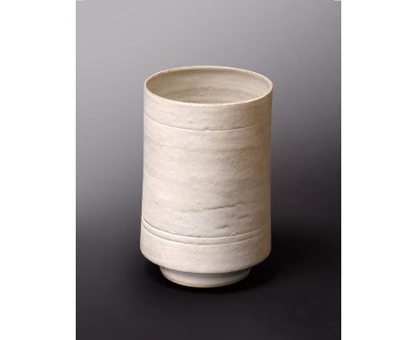 Dame Lucie Rie DBE (1902-1995): A Stoneware Cylindrical Vase, covered with an all over white glaze, impressed seal mark to ba