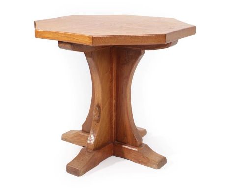 Workshop of Robert Mouseman Thompson (Kilburn): An English Oak Octagonal Coffee Table, post 1960, adzed top, on a cruciform b