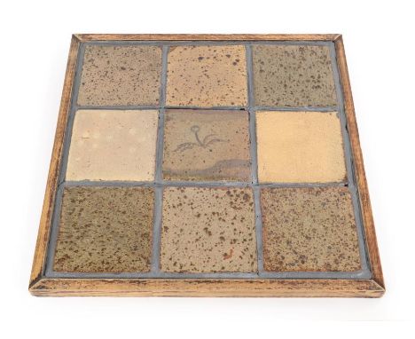 Leach Pottery: Nine Stoneware Tiles, the central tile decorated with a flower, one tile with exposed St Ives pottery mark, 10