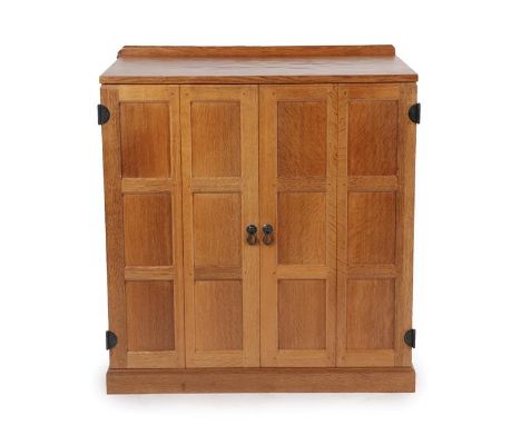 Workshop of Robert Mouseman Thompson (Kilburn): An English Oak Entertainments Cupboard,1994, raised upstand above with two fo