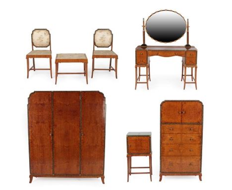 A Bath Cabinet Makers Art Deco Seven Piece Amboyna Burl and Walnut Bedroom Suite, ebonised and inlaid with abalone mother-of-