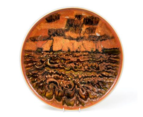 Tony Morris for Poole Pottery: A Studio Charger, circa 1962-4, painted with a seascape in orange, green and brown, painted mo