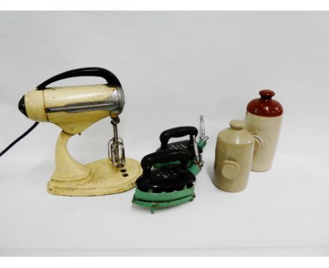 Vintage enamelled food mixer, together with two Rhythm number 375 U radiation irons, complete with their cradles and two ston