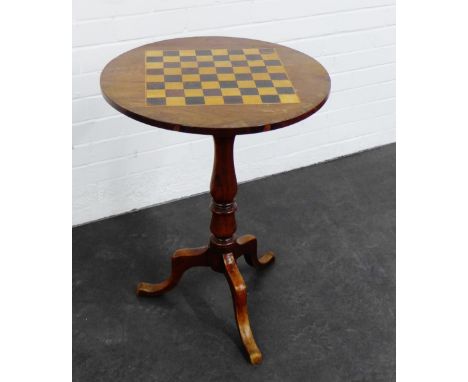 Mahogany games table, the circular top on a baluster turned column and  tripod legs, 70 x 51cm