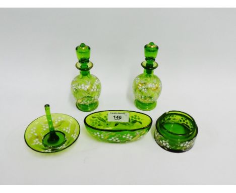 Group of five green glass dressing table bottles and dishes, painted with white enamel flowers with gilt highlights, (5) 