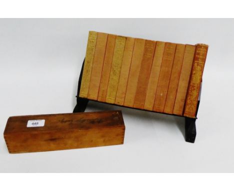 Set of vintage dominoes, together with a book trough containing a selection of Charles Dickens novels to include 'Our Mutual 