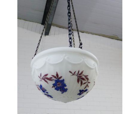 White opaque ceiling light painted with blue and red flowers