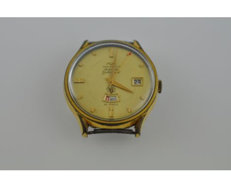 A Technos Automatic Gold Shield gentlemen's watch head, with date aperture at 3 o'clock position and day aperture at 6 o'cloc