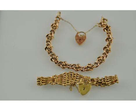 A gate-link yellow metal bracelet with a heart-shaped locket stamped 9ct; together with a similar fancy link bracelet, total 