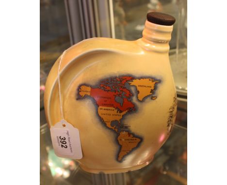 A Crown Ducal pottery emu wine flask made to commemorate the coronation of George VI, the body printed with a map of the empi