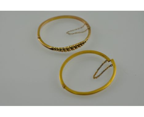 A 9ct gold bangle, with Chester mark, together with another bangle, total weight 12g.