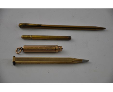 An Art Deco yellow metal pencil, marked 9ct Foreign', with alternating panels of fluted and engine-turned decoration; togethe
